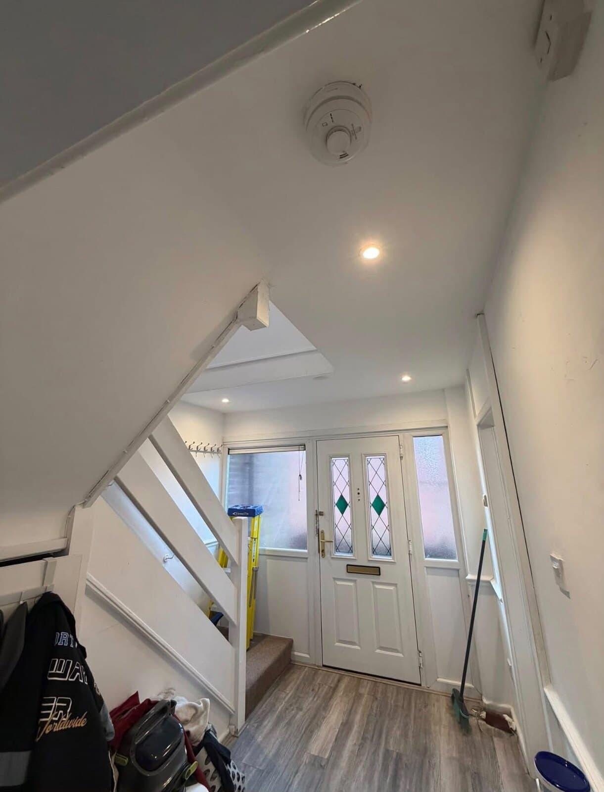 Finished hallway with new LED downlights lit and a mains smoke alarm fitted, St Helens