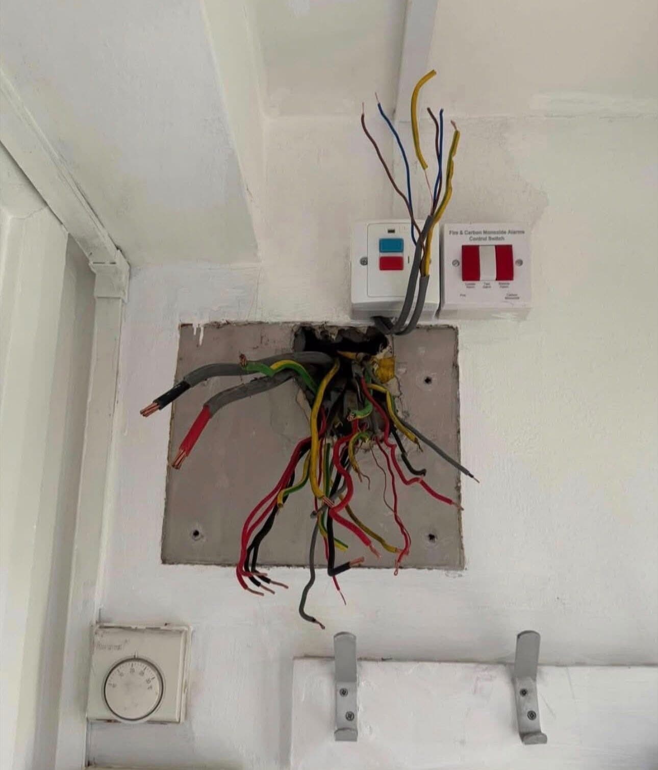 Old rubber and fabric wiring pulled out of a hallway wall during a rewire in St Helens